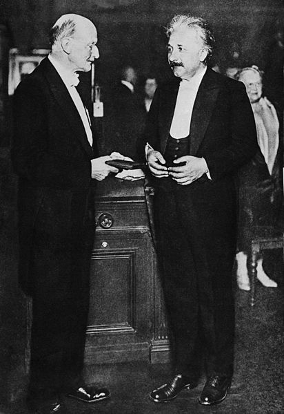 Planck junto a Einstein